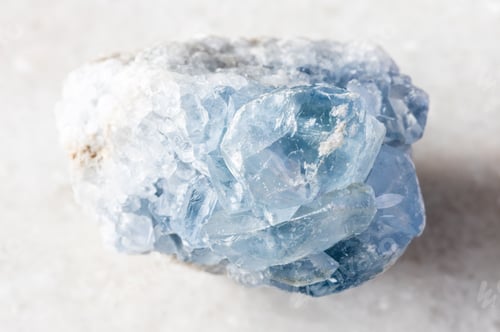Preview: sample of raw celestite mineral on white marble