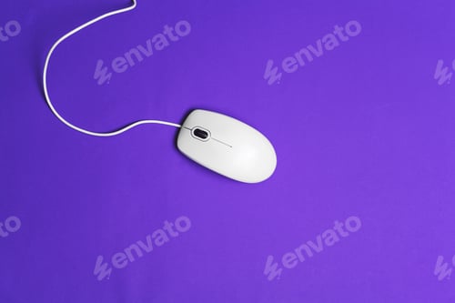 Preview: Computer mouse with a cord over a paper background