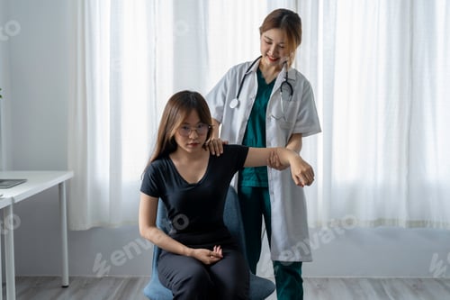 Preview: The doctor counsels the patient about pain in the muscles of the arms and elbows. office syndrome pr