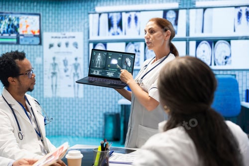 Preview: Doctors and healthcare staff review test results and ct scan x rays