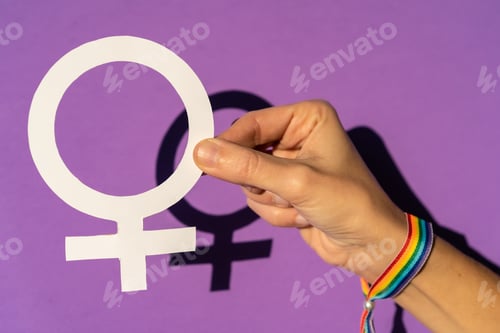 Preview: A woman holding a drawing in a vindication in favor of equality between men and women
