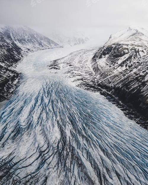 Preview: Aerial shot of a frozen river in the mountains