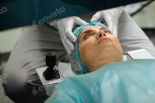Preview: Nice good looking woman having an eye test