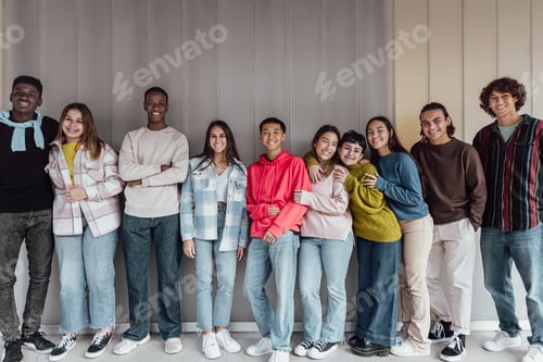 Preview: Happy multiracial group of teenagers having fun inside university - Young people lifestyle concept