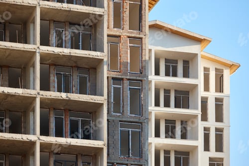 Preview: Building facades under construction. Work in progress. Development and investment