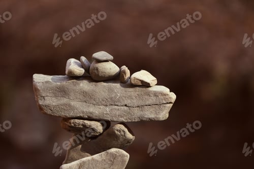 Preview: Tower of balancing stones against blurred background. Space for text