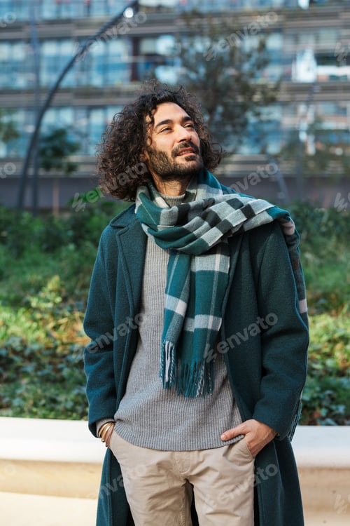 Preview: Businessman looking away while standing on the street at financial district
