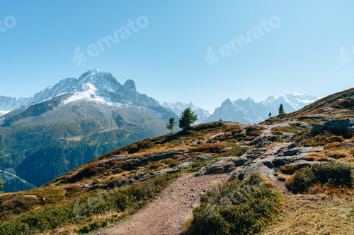 Preview: French Alps landscape of Mont Blanc massif with autumn wilderness during Col des Montets trail