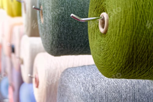 Preview: Assorted spools of multi-colored wool threads