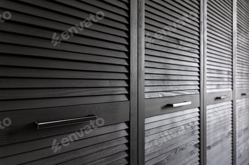 Preview: Close-up of a textured wooden black cabinet.