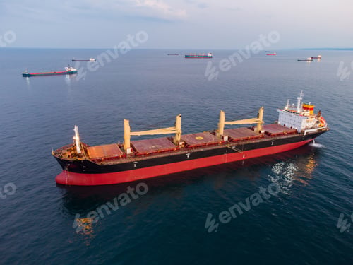 Preview: Large general cargo ship tanker bulk carrier, aerial view at night.