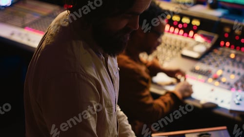 Preview: Musician playing piano midi controller in control room at recording studio