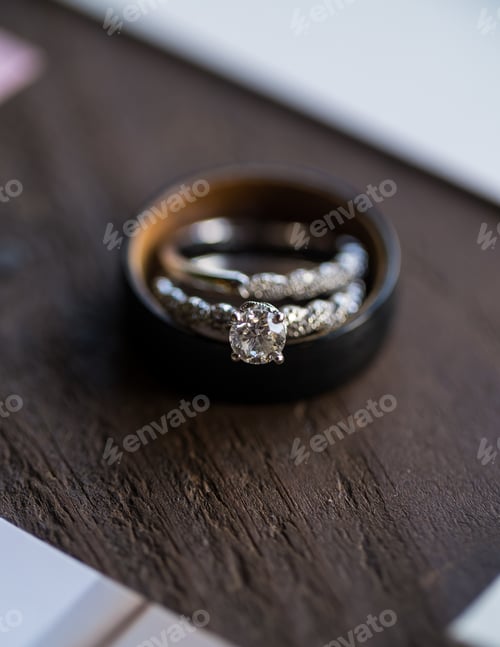Preview: Vertical selective focus shot of rings on wooden background