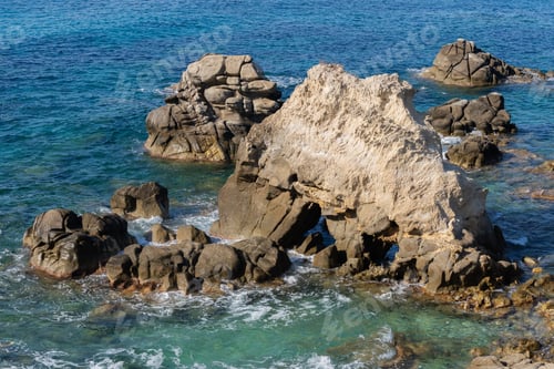 Preview: Waves on rocky beach, sea shore with waves crushing over the big rocks