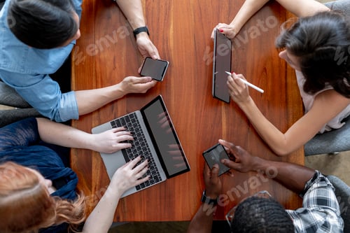 Preview: Diverse business people using digital devices
