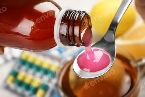 Preview: Pouring cough syrup from bottle into spoon on blurred background, closeup