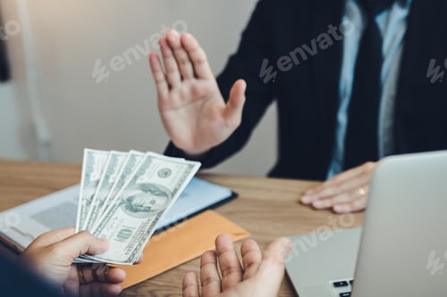 Preview: Businessperson refusing bribe given money by partner with anti bribery corruption concept.