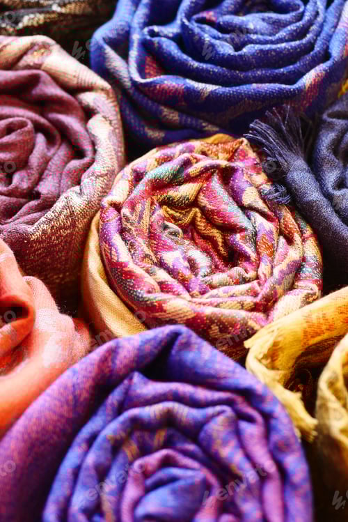 Preview: Rolled Up Luxurious Colorful Scarves on Display