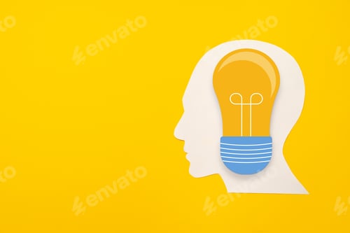 Preview: Papercut head and light bulb on paper background