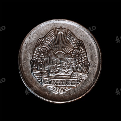 Preview: View of a Romanian five Bani coin isolated on a black background