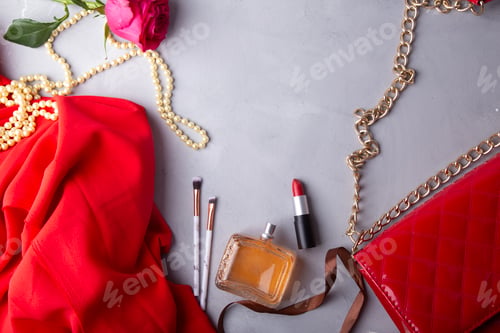 Preview: Red essentials with perfume, lipstick and fresh flowers