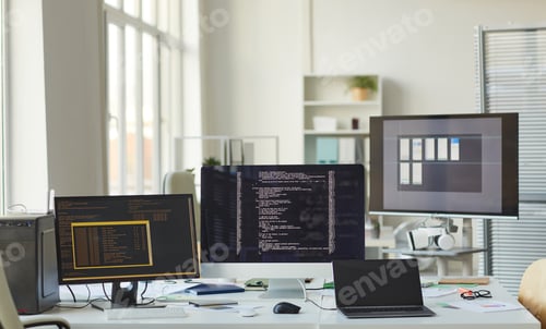 Preview: Background of Computers with Code on Screen in IT Office