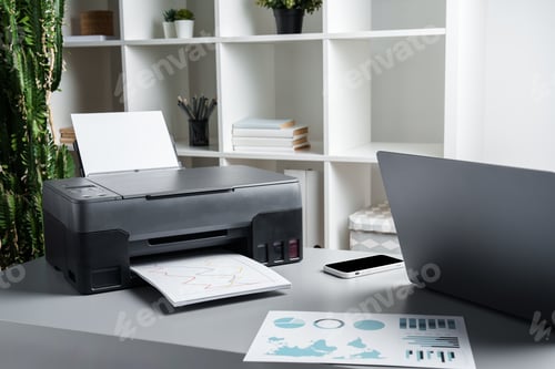 Preview: New modern printer and laptop in the office on table