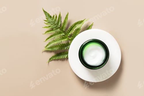Preview: Open jar of cosmetic cream. Beauty anti ageing cream, moisturizer texture of natural cosmetics