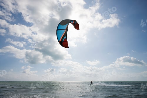Preview: Young man kitesurfing