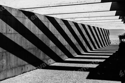 Preview: Concrete wall with deep shadows creating an intricate texture.