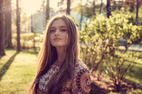 Preview: Female posing in a summer park.