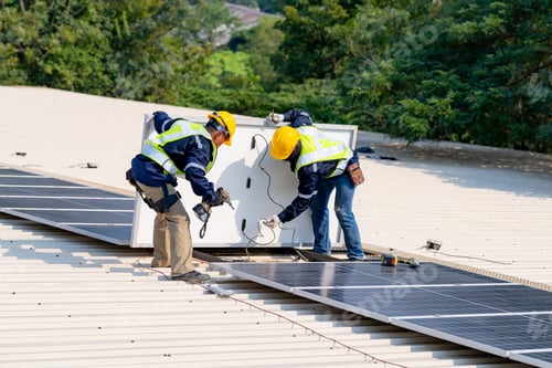 Preview: workers installing solar panels, for efficient energy on rooftop