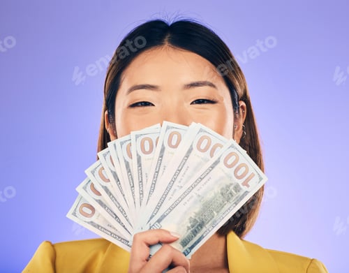 Preview: Money, beauty and woman cover face on purple studio background for winning, cash fan or financial p