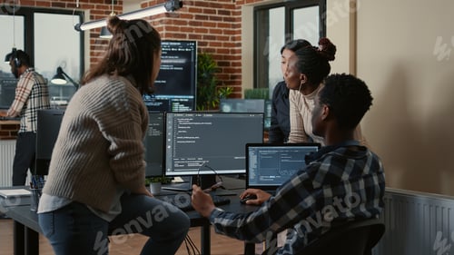 Preview: Software developers discussing about programming while the rest of the team joins the discussion