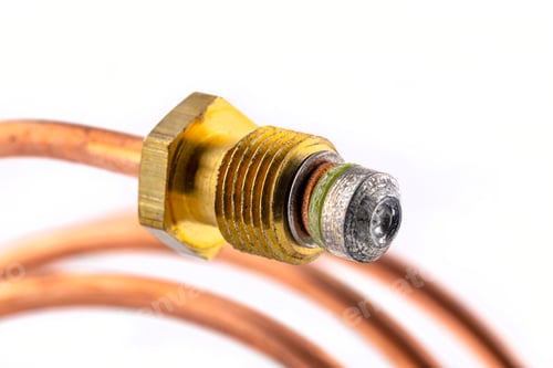 Preview: Macro photo of a spiral shaped temperature probe thread, isolated on a white background.