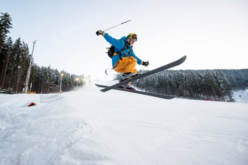 Preview: Flying skier man at jump from the slope of mountains
