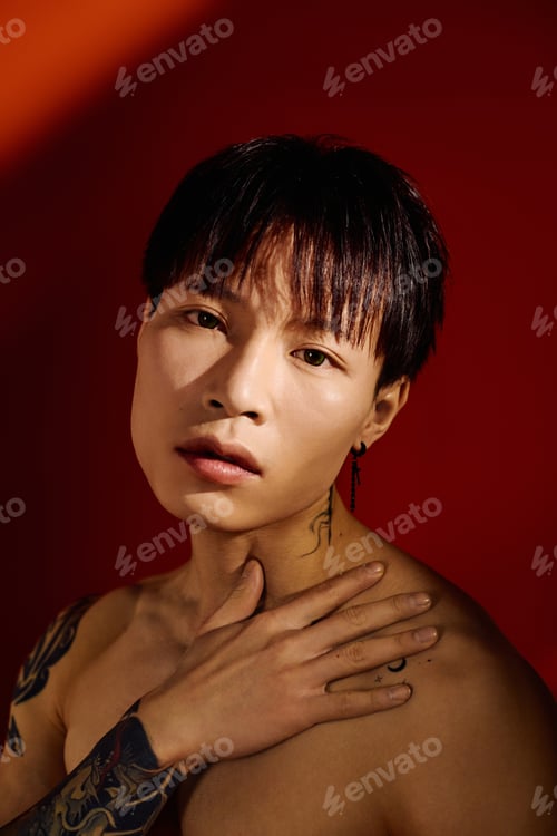Preview: Striking presence of a young stylish man posing confidently against a vibrant backdrop