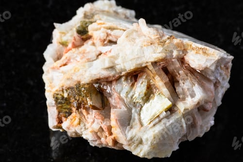 Preview: sample of albite rock with muscovite mica on black