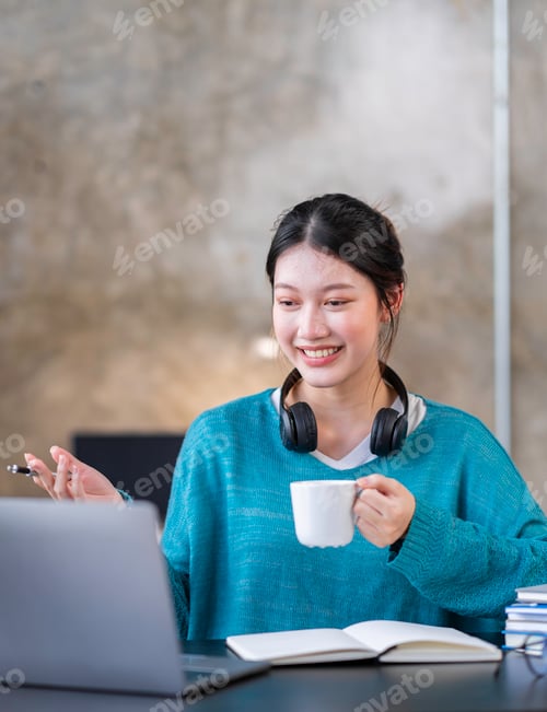 Preview: Young Asian business woman employee or executive manager using computer looking at laptop and talkin