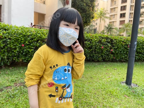 Preview: Happy girl with mask on