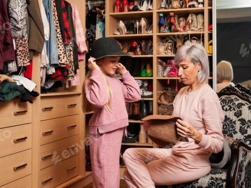 Preview: mother and daughter trying on hats
