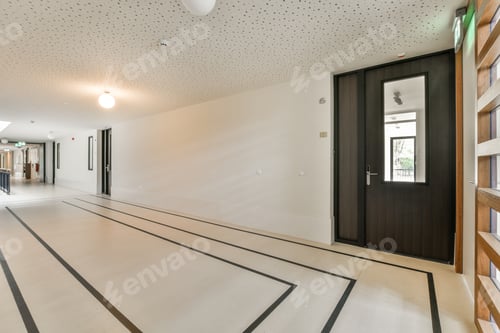 Hallway Interior with Tile Floor and Dark Door
