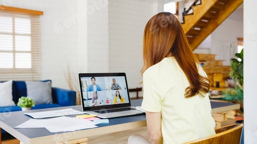 Preview: Asia businesswoman using laptop talk to colleagues in video call meeting at living room.
