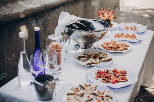 Preview: Delicious italian appetizers on table at wedding reception outdoors