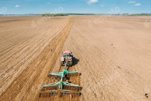 Preview: Aerial View. Tractor Plowing Field In Spring Season. Beginning Of Agricultural Spring Season