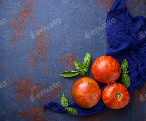 Preview: Fresh tomato on blue rusty background.