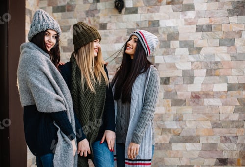 Preview: Three beautiful young girls in hats posing against the background of the park