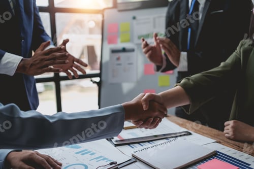 Preview: Business success. Business people handshake agreement confirmed in the investment business.