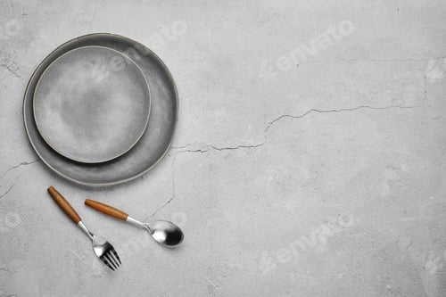 Preview: Overhead view of two plates and fork with spoon