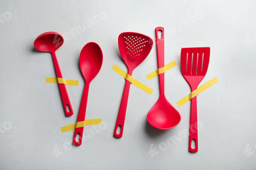 Preview: Set of clean kitchen utensils on grey background, flat lay